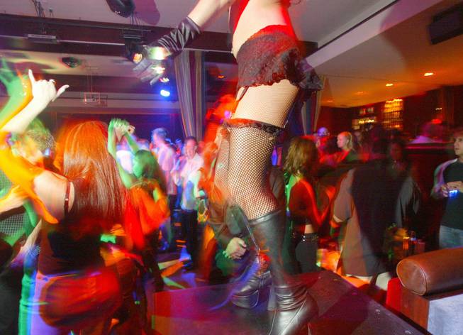Dancer Cassandra Mistak adds to the ambiance at the nightclub Light at the Bellagio in Las Vegas Sunday, May 18, 2003. Photo by Sam Morris